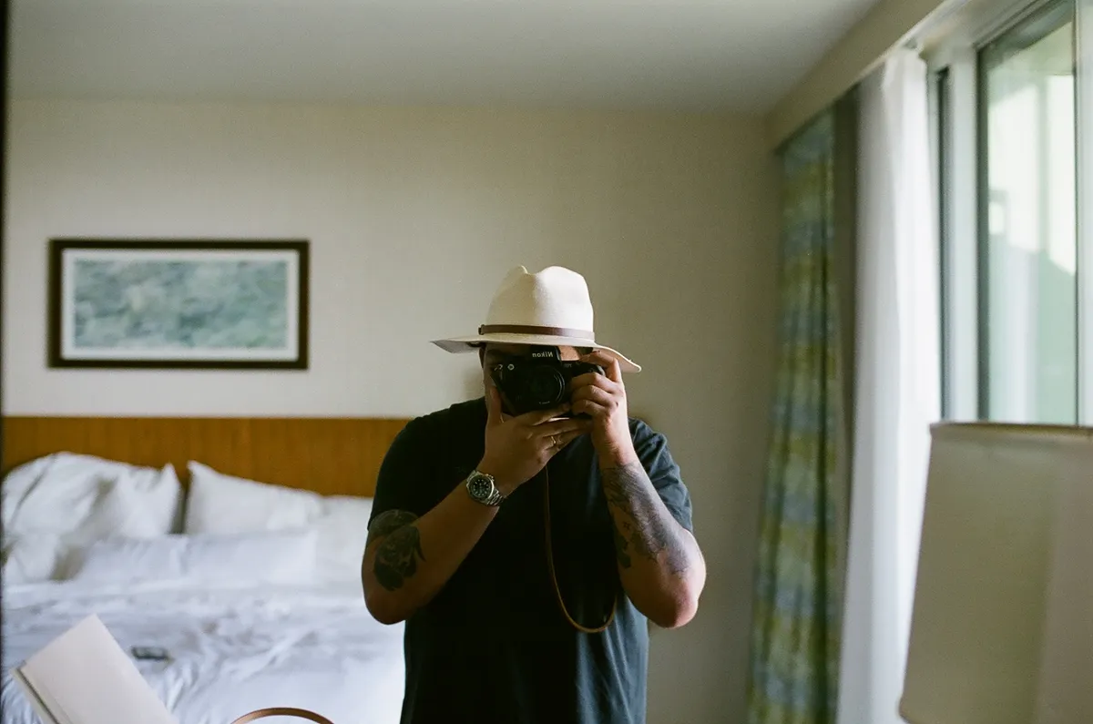 ryan selfie holding nikon f100
